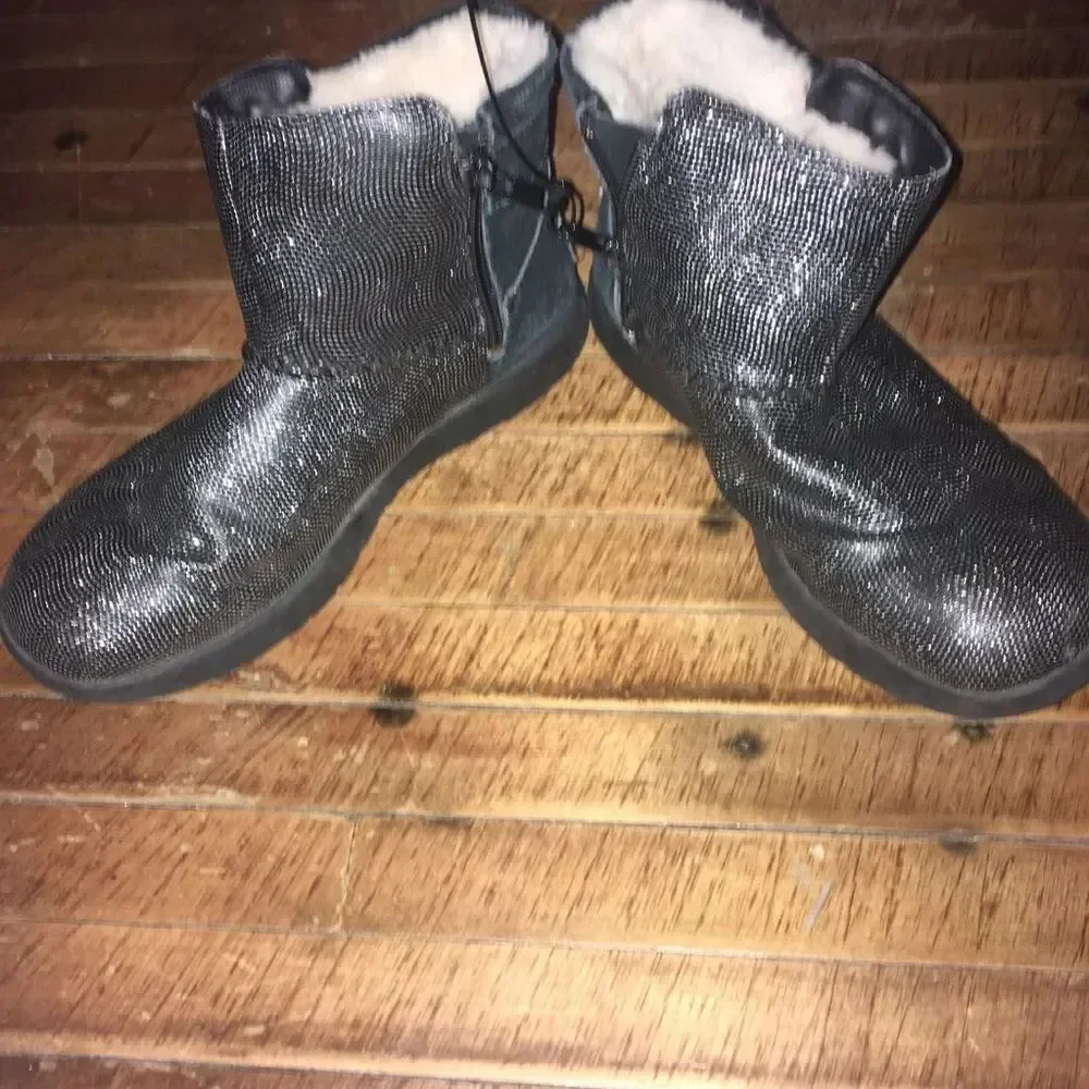 Uggs size 4 shimmery black and silver shearling lined booties